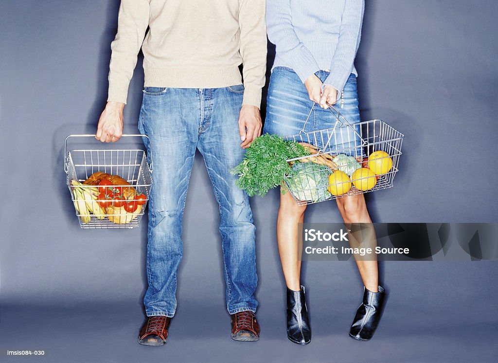 Man and woman with shopping basket  Adults Only Stock Photo