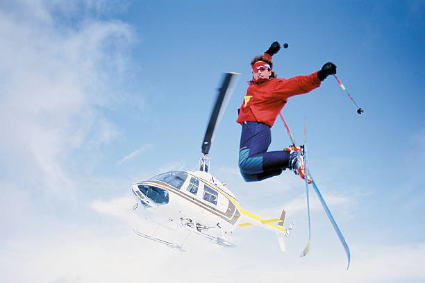 skier jumping from helicopter - heliskiing bildbanksfoton och bilder