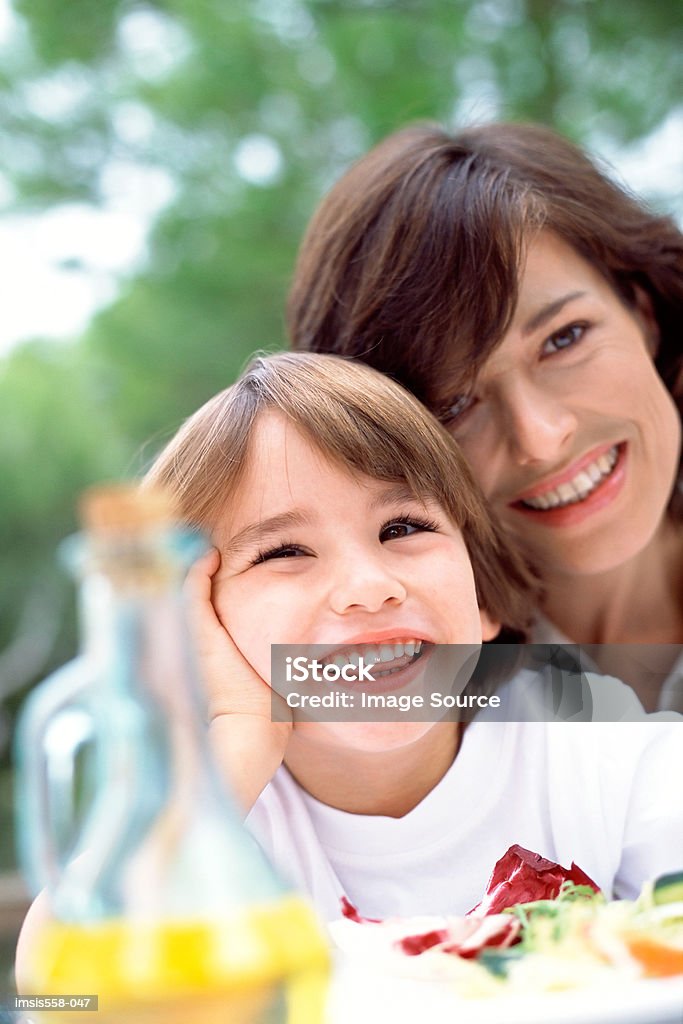 Mother son at lunch outdoors  Adult Stock Photo