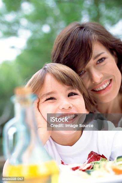 Mother Son At Lunch Outdoors Stock Photo - Download Image Now - Adult, Blond Hair, Boys
