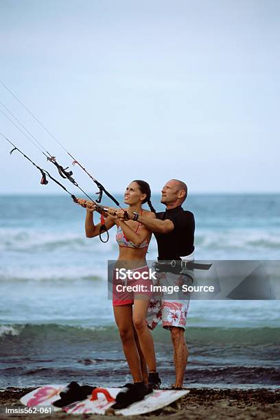 Parasurfing Couple Stock Photo - Download Image Now - Windsurfing, Kiteboarding, 20-29 Years