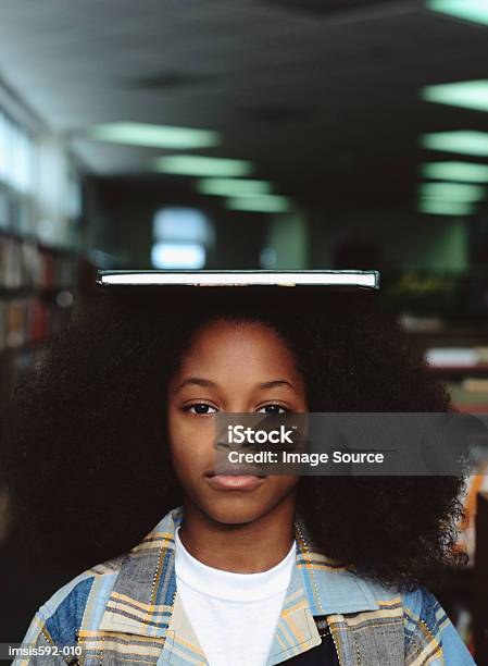 Boy Balancing Book On Head Stock Photo - Download Image Now - African-American Ethnicity, Afro Hairstyle, Balance