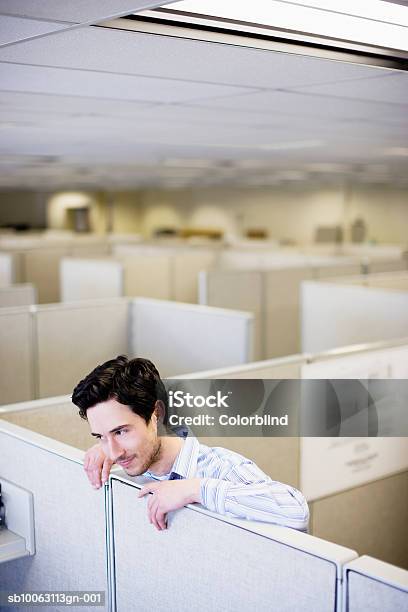 Office Worker Leaning On Partition Stock Photo - Download Image Now - 25-29 Years, Adults Only, Business