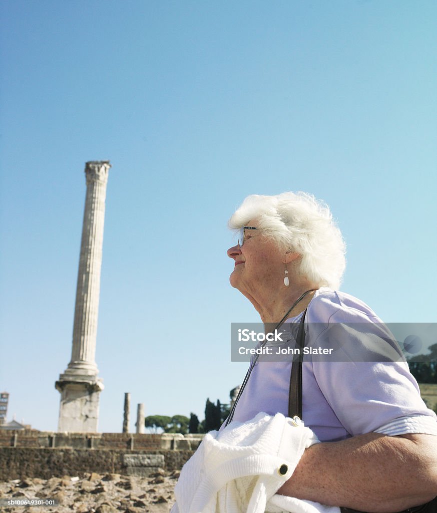 Senior woman at ancient site, side view  70-79 Years Stock Photo