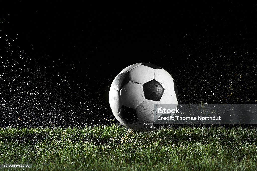 Soccer ball in motion over grass Soccer Stock Photo