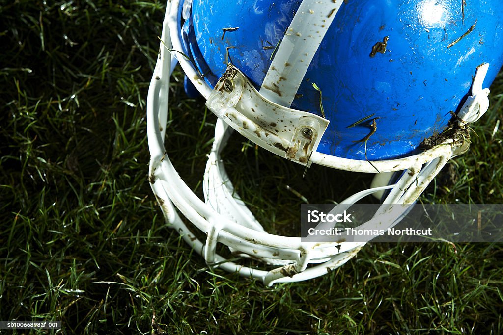 Football helmet on grass  Football Helmet Stock Photo