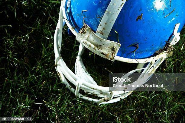 Football Helmet On Grass Stock Photo - Download Image Now - Football Helmet, High Angle View, Dirty