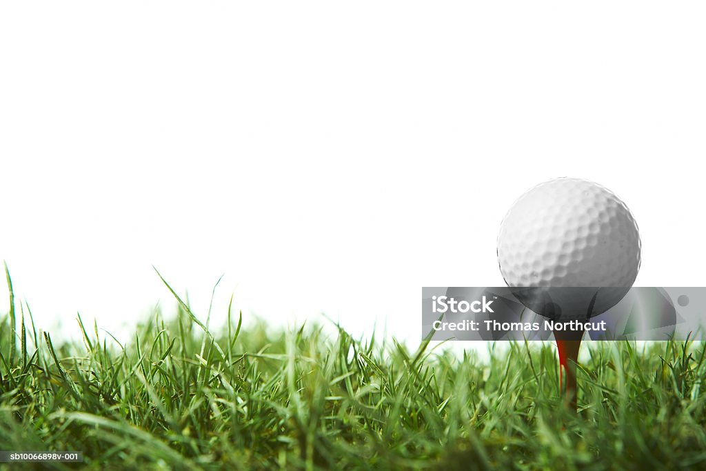 Golfball on tee Golf Stock Photo