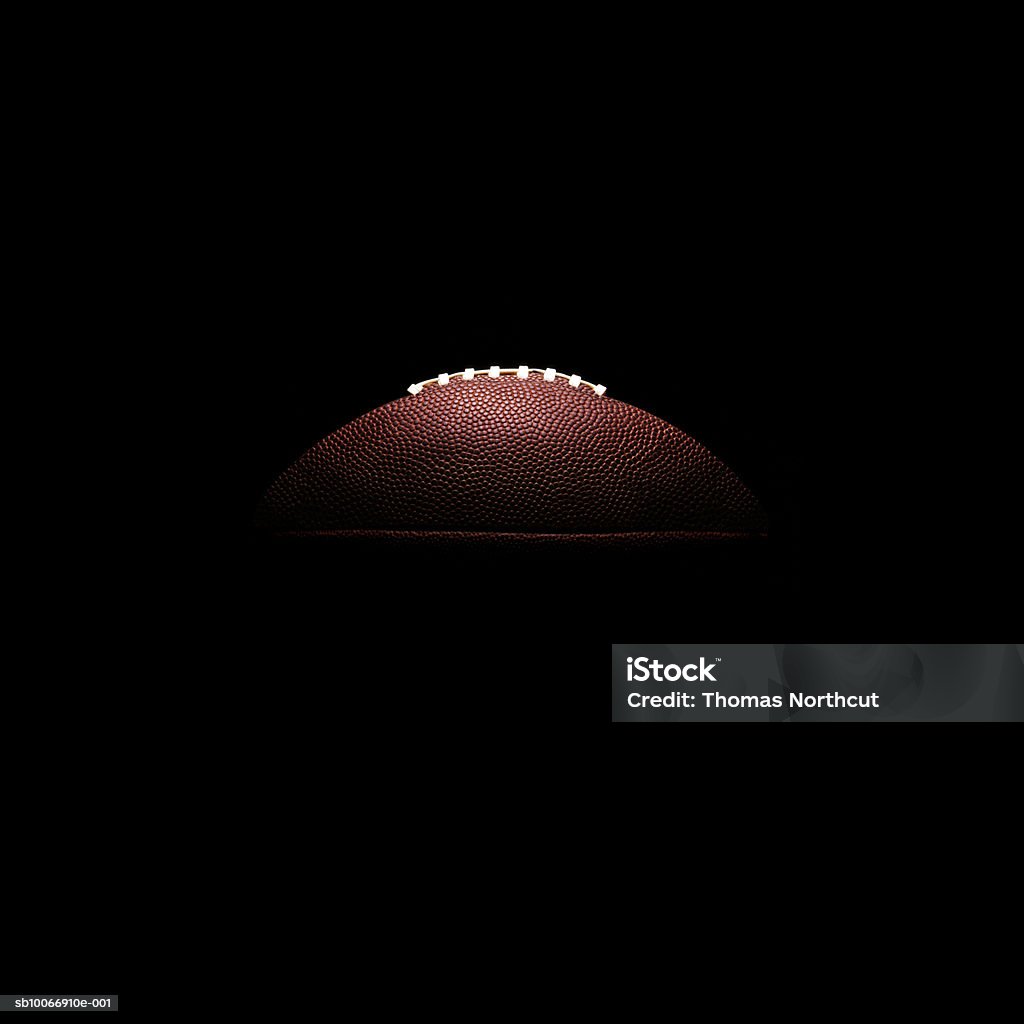 American football ball on black background American Football - Sport Stock Photo