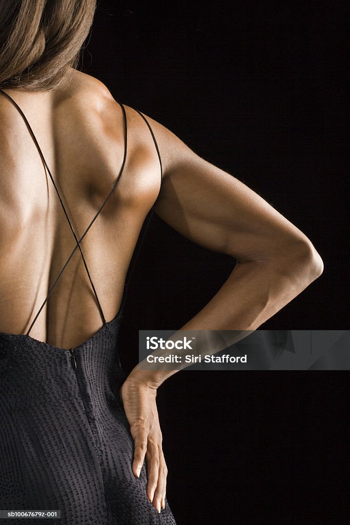 Athletic woman, rear view, studio shot  35-39 Years Stock Photo