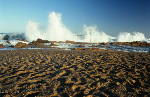 Close up shot of waves at the beach in Carlsbad, California, United States