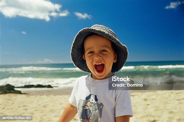 Boy Laughing On Beach Portrait Stock Photo - Download Image Now - Beach, Cabo Polonio, Cheerful
