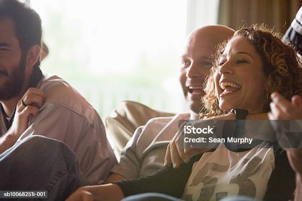 Group Of Friends Watching Tv Stock Photo - Download Image Now - Watching TV, Friendship, Sport