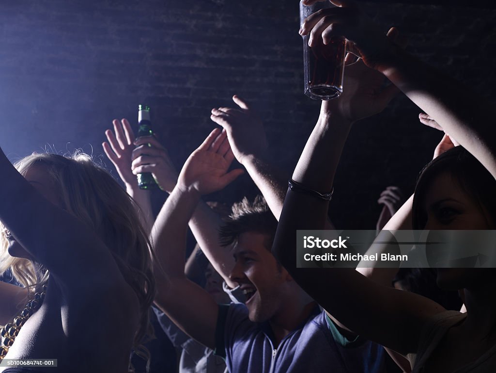 Group of friends celebrating at party in night club  16-17 Years Stock Photo