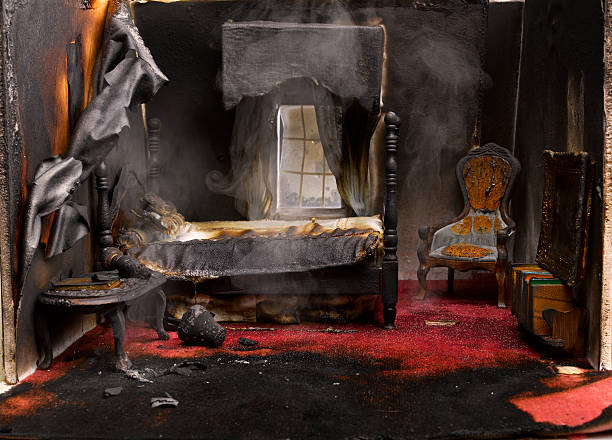 Fire in bedroom of model house, close-up  burning house stock pictures, royalty-free photos & images