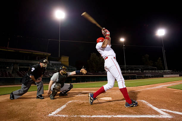 USA, California, San Bernardino, baseball players with batter swinging  baseball sport stock pictures, royalty-free photos & images
