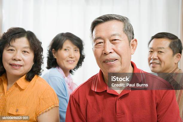 Mature And Senior Couple Smiling Stock Photo - Download Image Now - 45-49 Years, 55-59 Years, 70-79 Years