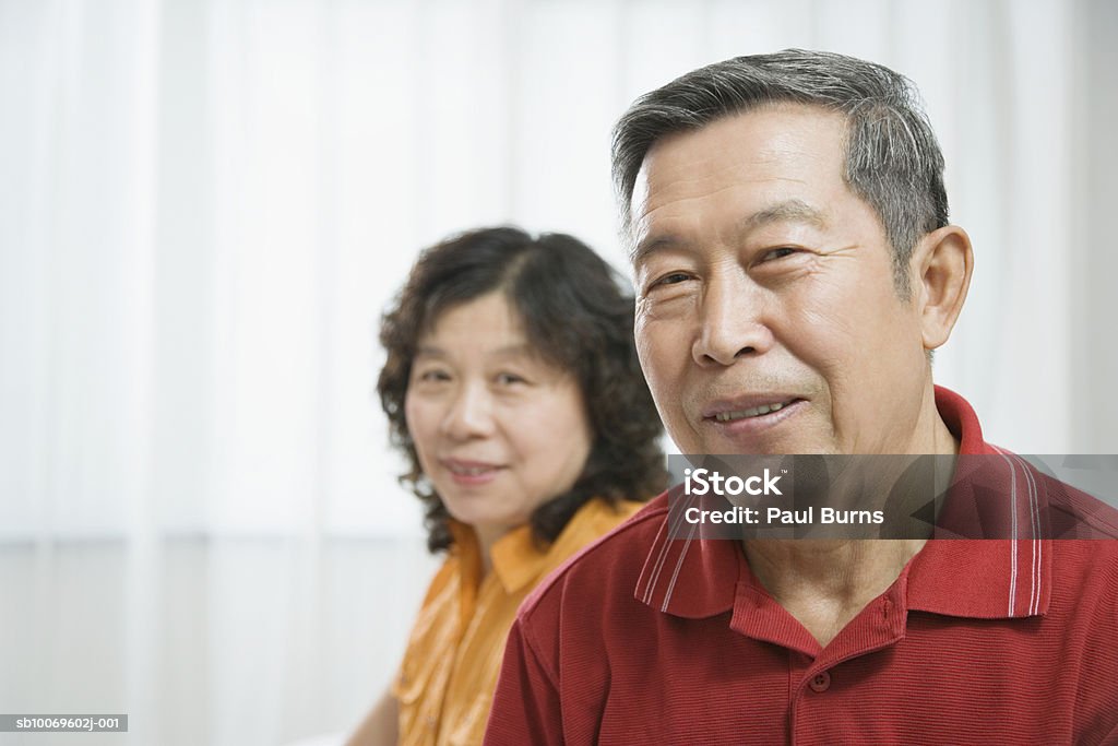 Mature woman and senior man, smiling  45-49 Years Stock Photo