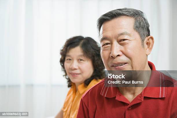 Mature Woman And Senior Man Smiling Stock Photo - Download Image Now - 45-49 Years, 70-79 Years, Active Seniors