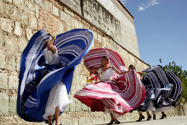 Mexico, Oaxaca, Istmo, four women in traditional dress dancing, blurred motion  black hair braiding stock pictures, royalty-free photos & images