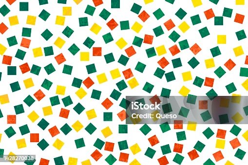 istock Abstract illustration. Yellow, orange and green squares of confetti painted on a white background. Colorful and pop 1428270038
