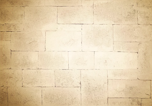 Background - antique stone masonry in large blocks in light colors
