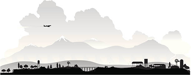 countryside silhouette "A silhouette of some high plains countryside with snow peaks in the distance. The silhouette is highly detailed, with farm buildings, birds, a tractor,girder bridge, waterfall etc etc." storm silhouettes stock illustrations