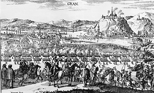 The Battle of Gran was a military conflict on August 16, 1685 between the armies of the Holy Roman Empire and the Ottoman Empire during the Great Turkish War (1683–1699). The battle near the present-day town of Esztergom (Gran) ended with the defeat of the Ottoman troops. The Great Turkish War between the Holy League of European Powers and the Ottoman Empire, also known as the Great Turkish War of Leopold I or the 5th Austrian Turkish War, lasted from 1683 to 1699. Under its new Grand Vizier and Commander-in-Chief Kara Mustafa, the Ottoman Empire tried for the second time in 1683 (after the first Turkish siege of Vienna in 1529) to conquer the imperial city of Vienna and to open the gate to Central Europe. The failure of this siege led to the imperial counter-offensive, in the course of which the Ottomans were expelled from the territory of the Kingdom of Hungary and the tripartite division of Hungary in favor of the Habsburgs came to an end. Illustration from 19th century.