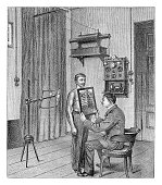 istock Doctor analyzing an x-ray - vintage illustration 1361873870
