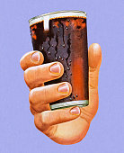 istock Hand Holding Glass of Cola 472044790