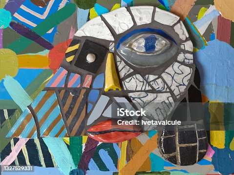 istock A human face on a colourful painted background 1327529331