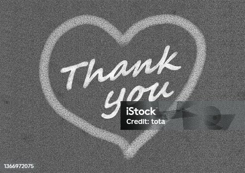 istock Illustration of a heart mark and the word "Thank you" in white chalk on a black background 1366972075
