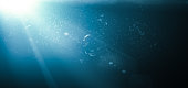 istock Light and Blue Gradient Background with Dust Defocused Particles 1347312784