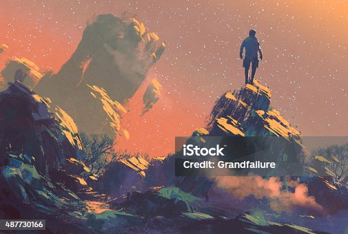 istock man standing on top of the hill watching the star 487730166