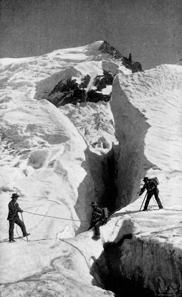 ilustrações de stock, clip art, desenhos animados e ícones de men crossing a snow bridge while climbing mont blanc in auvergne-rhine-alpes, france - 19th century - mont blanc