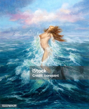 istock Mermaid exits ocean 1323760439