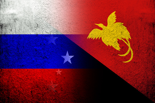National flag of Russian Federation with The Independent State of Papua New Guinea National flag. Grunge background