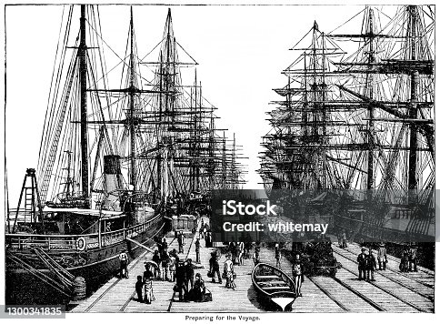 istock Sailing ships, passengers and cargo at a busy pier 1300341835
