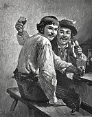 istock Two happy revelers in the pub 1301606333
