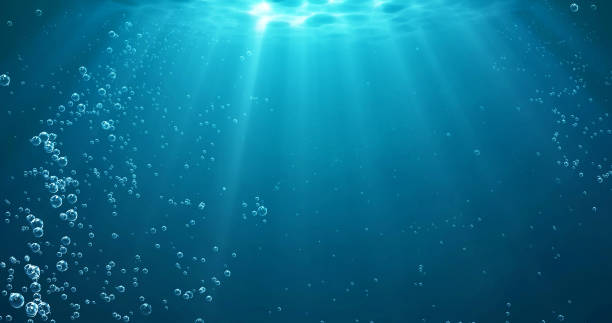 illustrations, cliparts, dessins animés et icônes de fond sous-marin avec des bulles d’eau et des rayons de lumière sous-marins brillent - fond marin