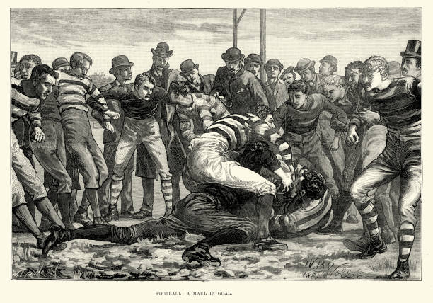 Victorian Rugby Football - Maul in Goal, 1882 Vintage engraving of Rugby football players in a maul in goal. A maul occurs when a player carrying the ball is held by one or more opponents, and one or more of the ball carrier's team mates bind on the ball carrier. Once a maul has formed other players may join in but, as in a ruck, they must do so from their own side. The London Illustrated News, 1882 rugby league stock illustrations