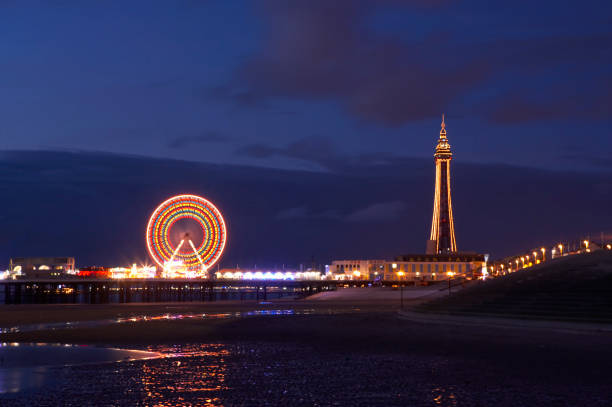 BLACKPOOL TOWER PIER ILLUMINATIONS BLACKPOOL TOWER AND PIER ILLUMINATIONS AT NIGHT blackpool tower stock pictures, royalty-free photos & images