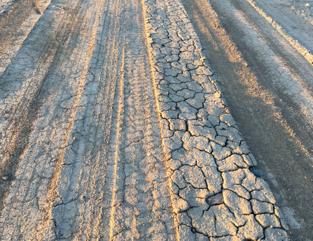 TIRE TRACKS IN DRIED MUD stock photo