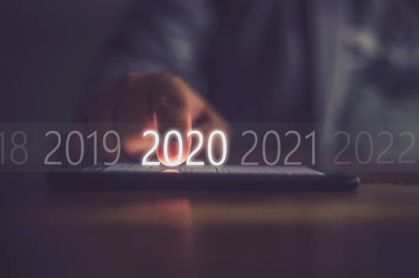 2020 Business men press numbers 2020 at the mobile phone screen
.Concept welcome merry christmas and happy new year 2020 2020 stock pictures, royalty-free photos & images