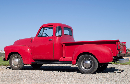 An old red pick up truck.
