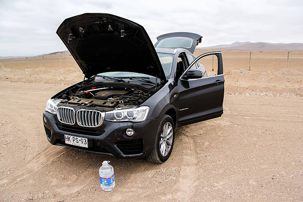 BMW F26 X4 Copiapo, Chile - November 14, 2015: Motor car BMW F26 X4 with an opened bonnet is parked in the Atacama desert. bmw stock pictures, royalty-free photos & images