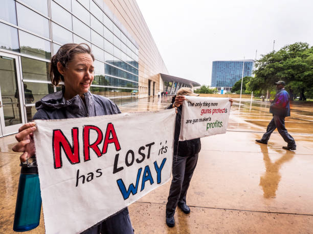 NRA She got wounded when a gun accidentally went off, and says there have been 12 of her friends either wounded or killed by guns. So she came on her own from Austin, Texas, to tell the NRA how she feels about guns. nra stock pictures, royalty-free photos & images
