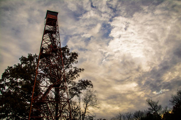 150-Foot Fire tower in Mohican State Park 150-foot Red Fire tower in Mohican State Park in Ohio fire lookout tower stock pictures, royalty-free photos & images