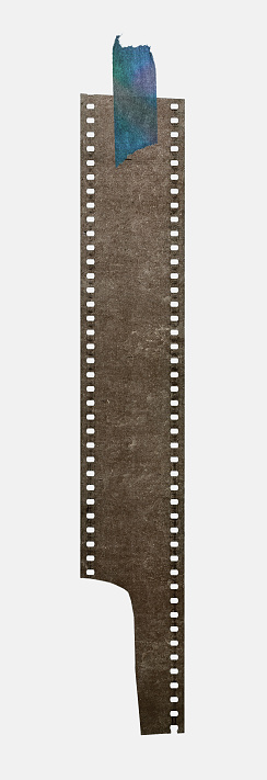 long dusty 35mm film strip fixed by single paper sticker on white background.