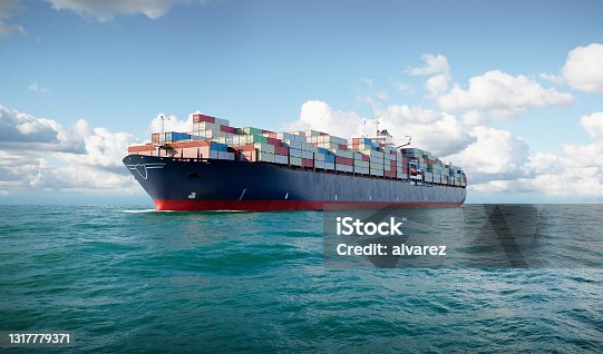 istock 3d cargo container ship in sea 1317779371